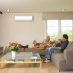 Family on couch in air conditioning image