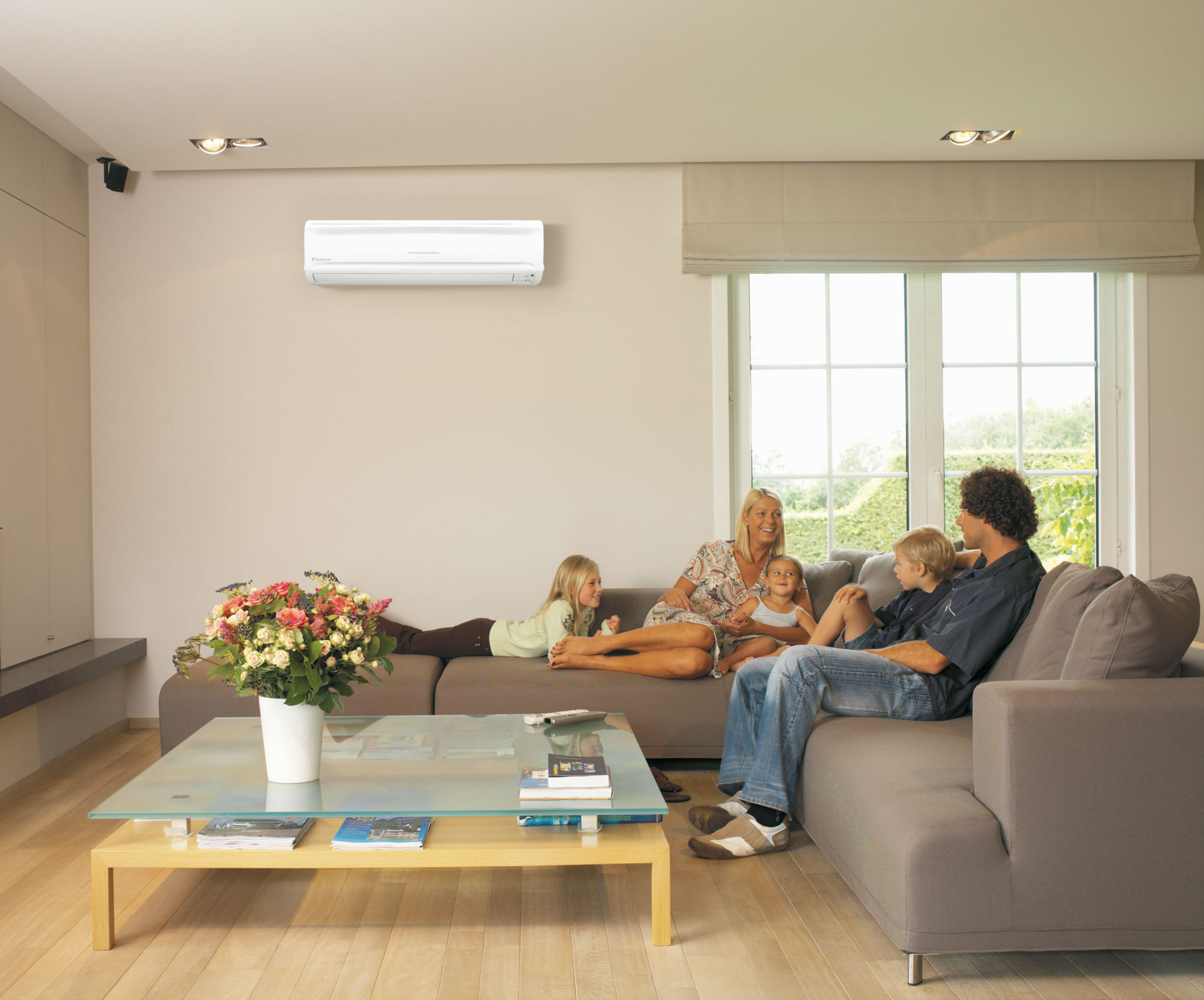 Family on couch in air conditioning image